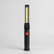 Чорний складаний ліхтар Worklight W-52 з акцентом на довгу світлодіодну COB-панель жовтого кольору та червону кнопку увімкнення.